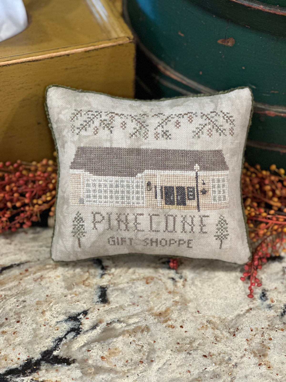 Pine Cone Gift Shoppe Cross-stitched Pillow